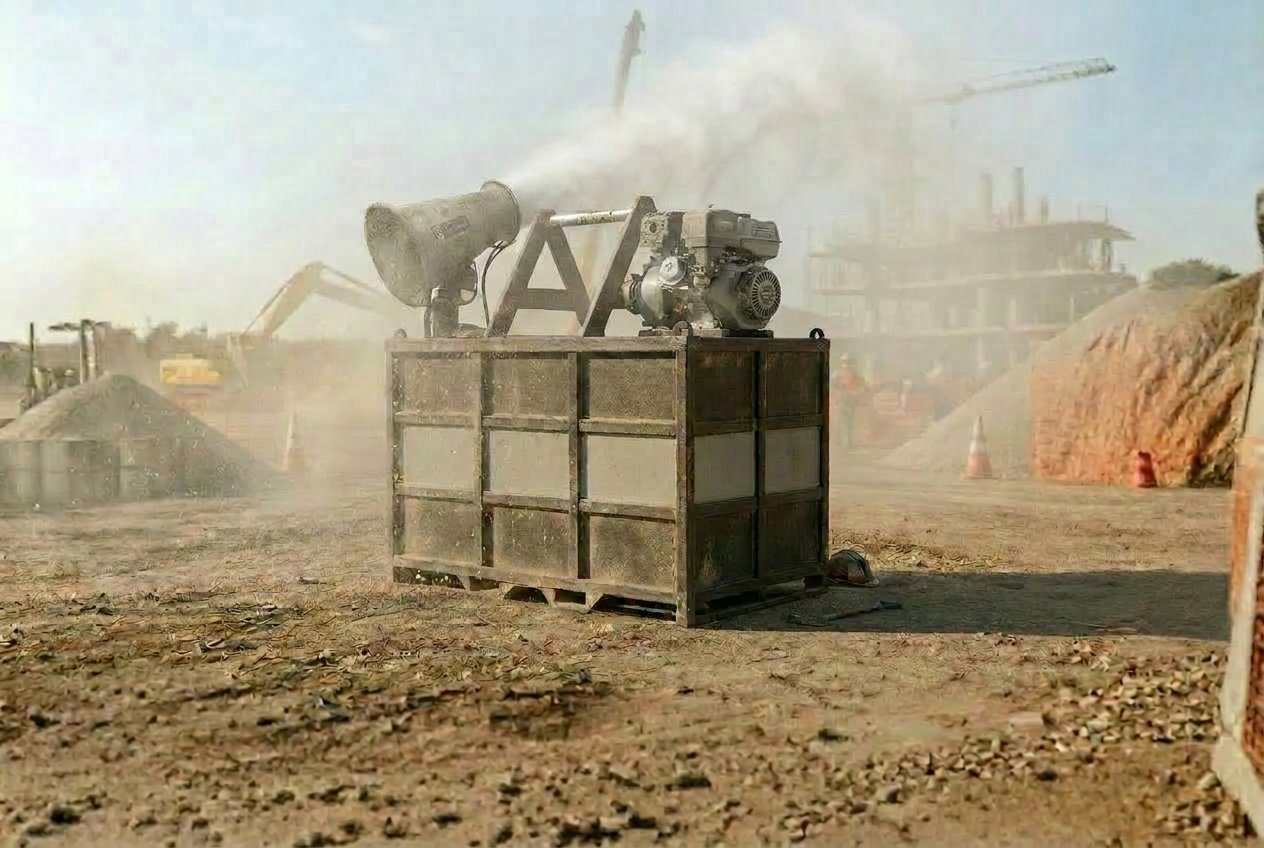 MWE DustBag dust suppression unit with oscillating cannon actively spraying mist over a dusty construction site